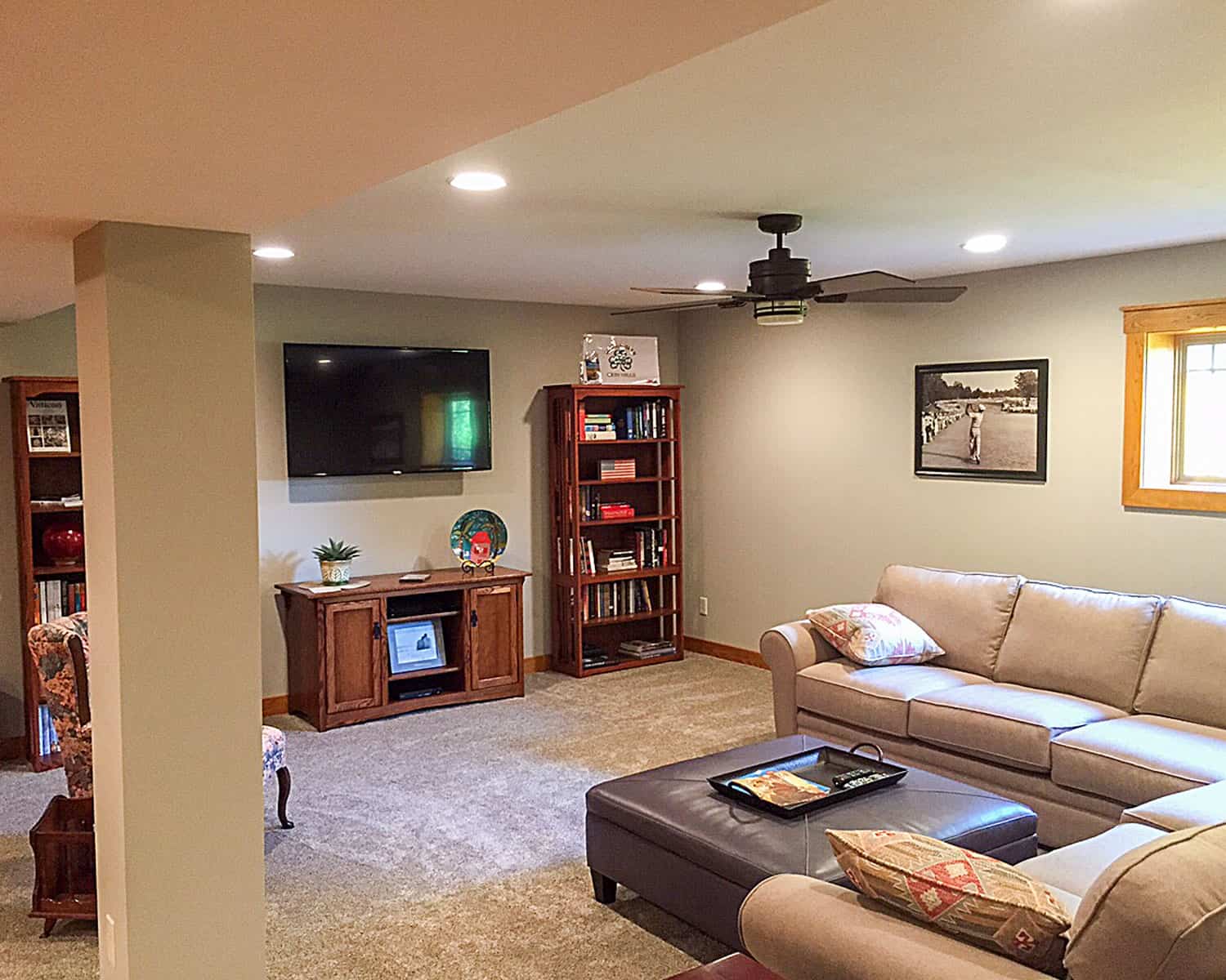 Lemel Homes Remodeling - Basement - Livingroom area with shelves and television
