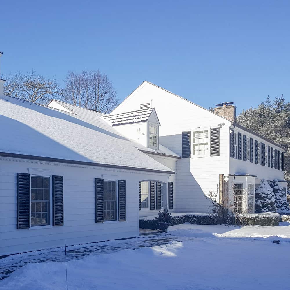 front of house with snow covering